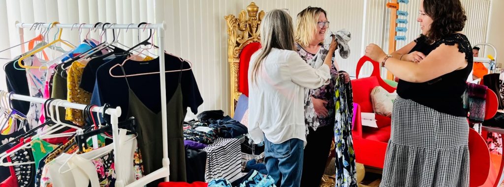 People sorting a pile of clothing